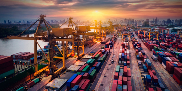 Shipping container outdoor warehouse with city skyline in background