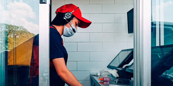 Drive-Thru server at cash register