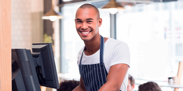 Cashier posing for photograph