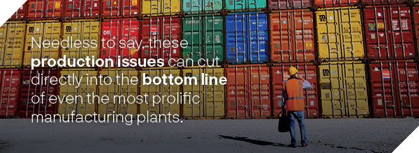 Worker standing in front of a large number of freight containers