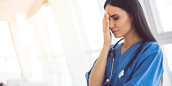 Nurse taking a second to collect thoughts