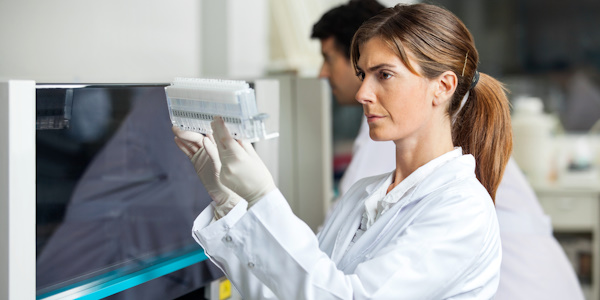 Lab tech viewing a sample