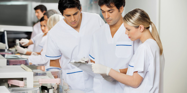 Lab techs working together during tests