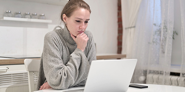 Woman reviewing accounts checking for fraud