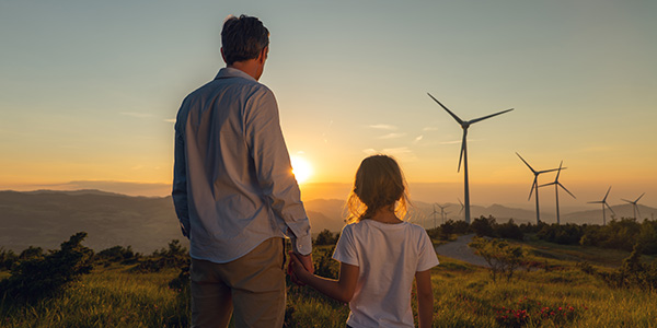 Parent and child viewing sunset together