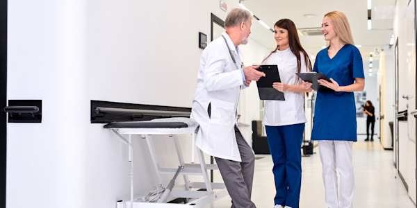 Lab techs discussing with manager