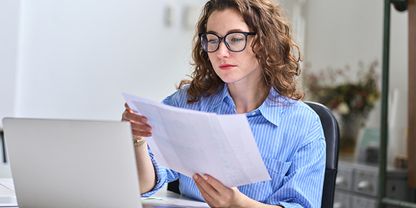 woman checking her sluggish receivables