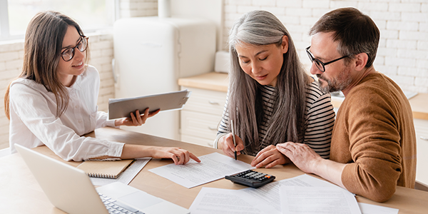 Advisor walking couple through their financial wellness